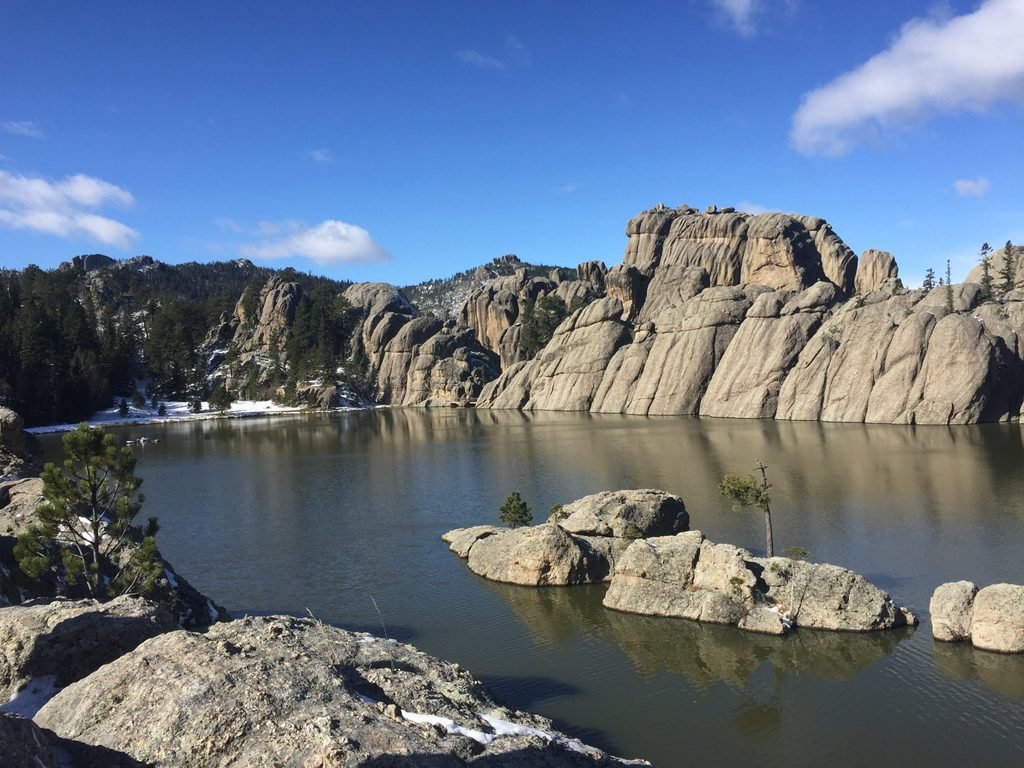 boulders on a blue lake