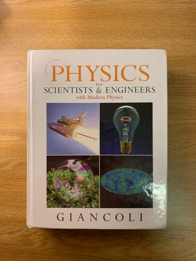 Physics for Scientists & Engineers by Giancoli on a desk.