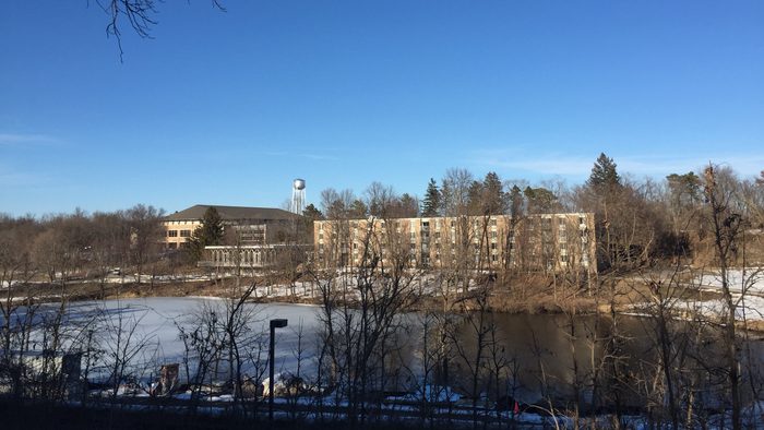 A college dorm across a half frozen river