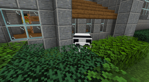 A Minecraft panda hiding in some bushes near Minecraft Skinner