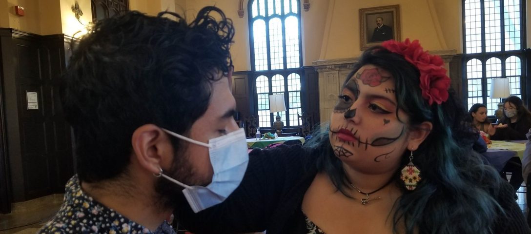 A Student Paints the Face of Another