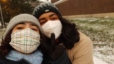 My friend Jyothi and I embracing our first-ever snow day