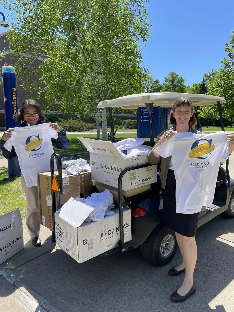 President Byerly and Dean Livingston hand out April Fools logo shirts