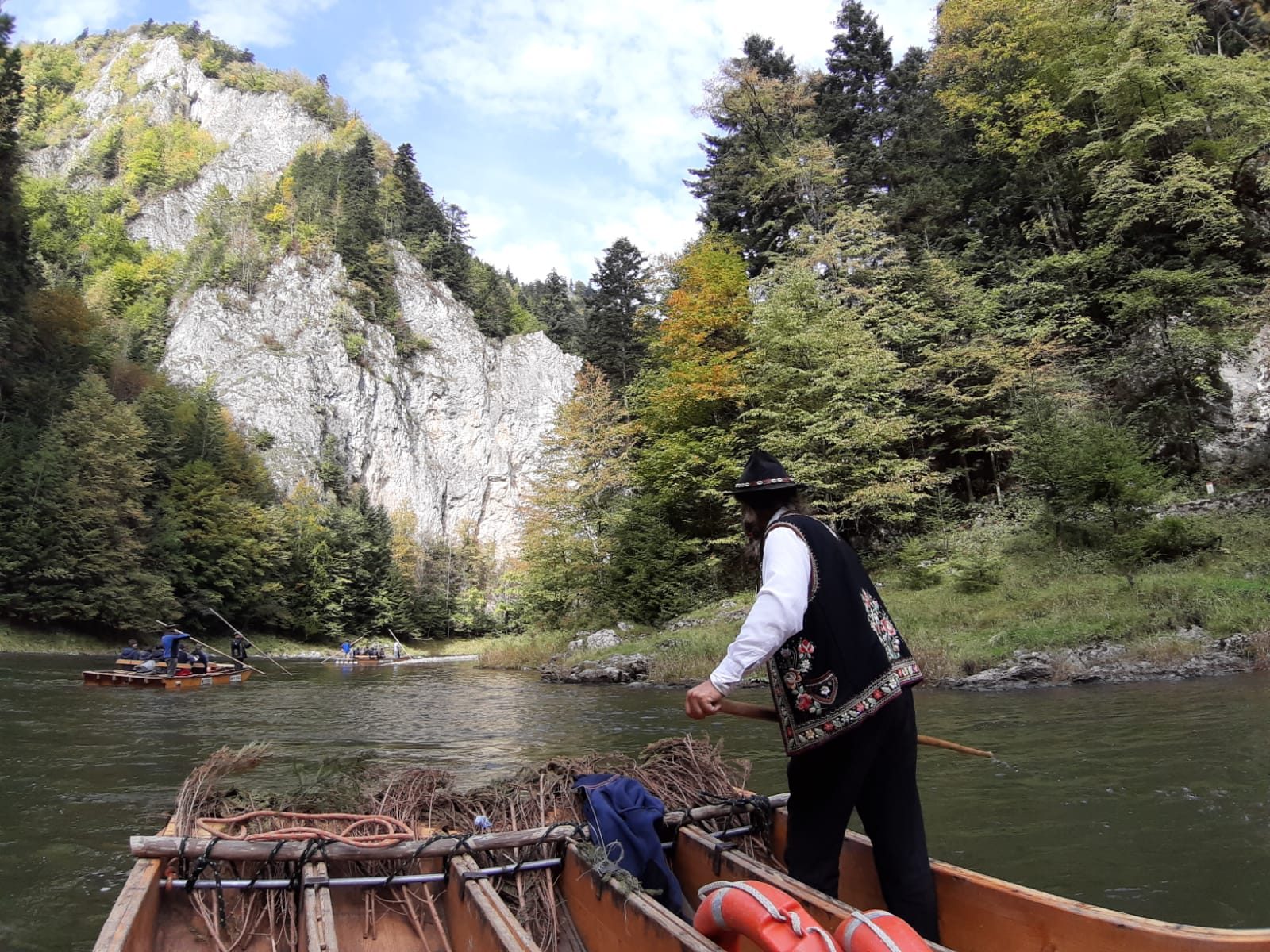 A Slovak man guides the canoe through the Dunajec River.
