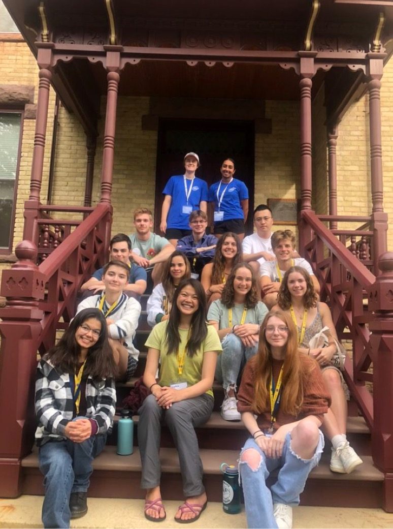 New Student Week Group 29 smiles on the steps of Nuttinghouse