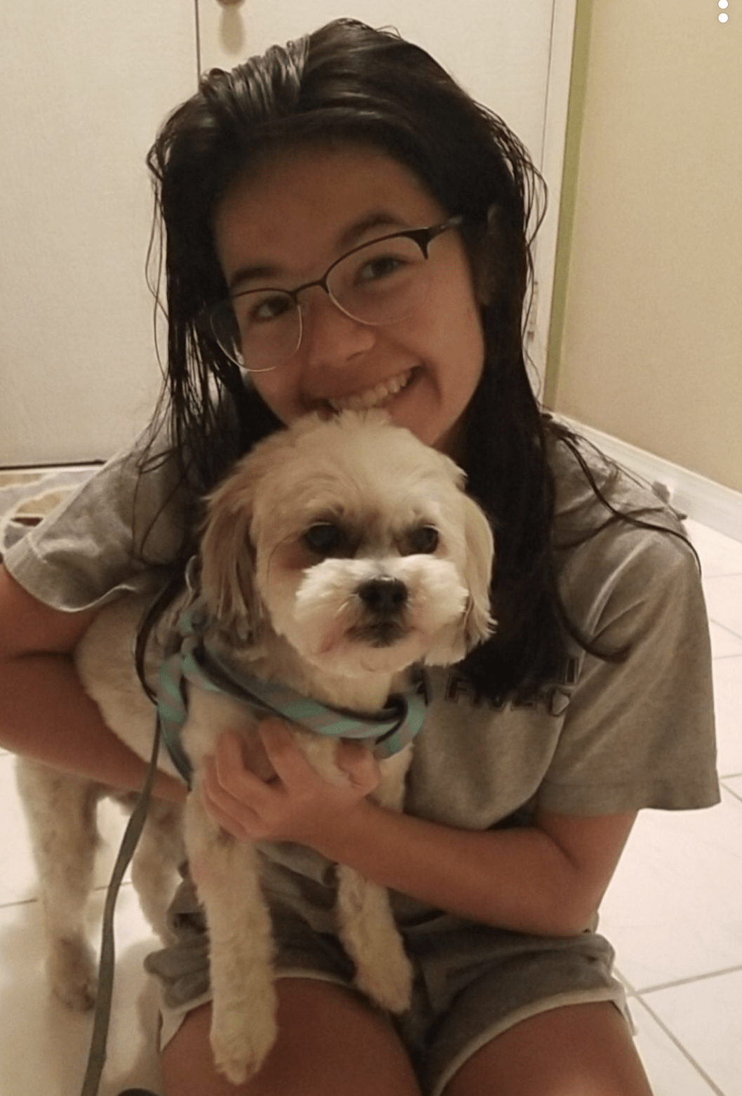 Lexi and her dog, Athena, pose