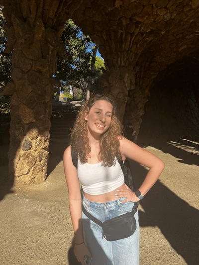 student smiling in the sun