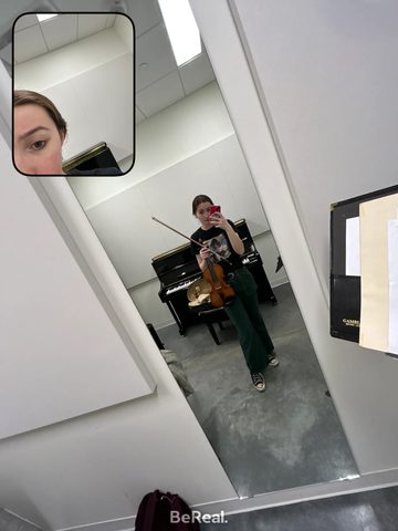 Quinn practices violin in a Weitz practice room