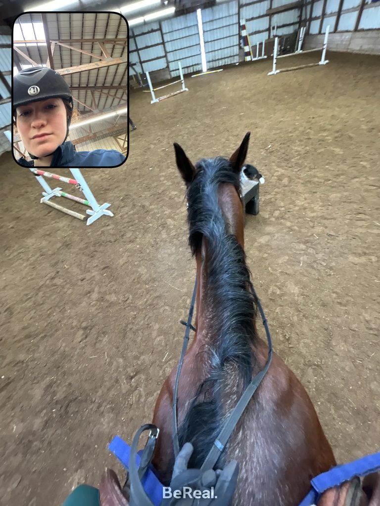 Quinn rides a horse as a member of the Equestrian club team.