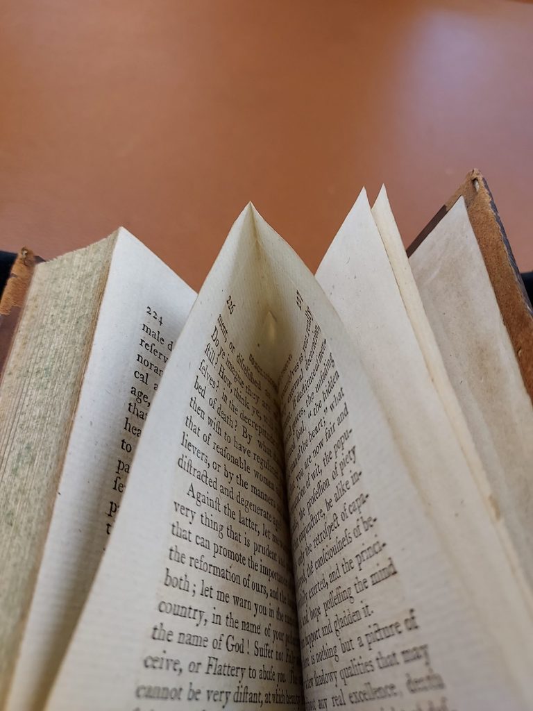 an uncut back page of a book