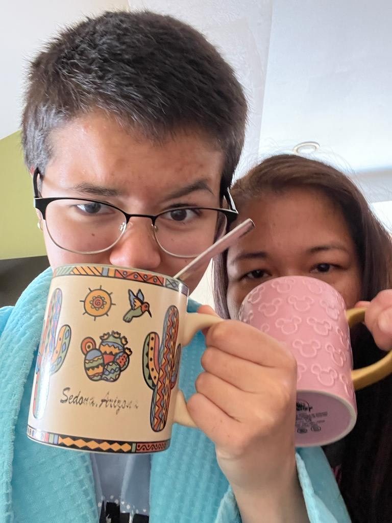 Lexi and her mom sip on cups of coffee