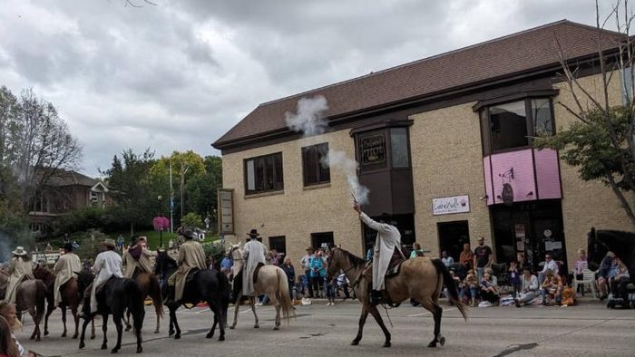 Northfield Jesse James Day parade. Horses walking around downtown