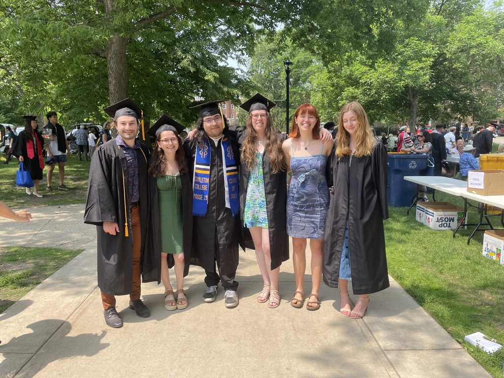 Six friends posing at graduation