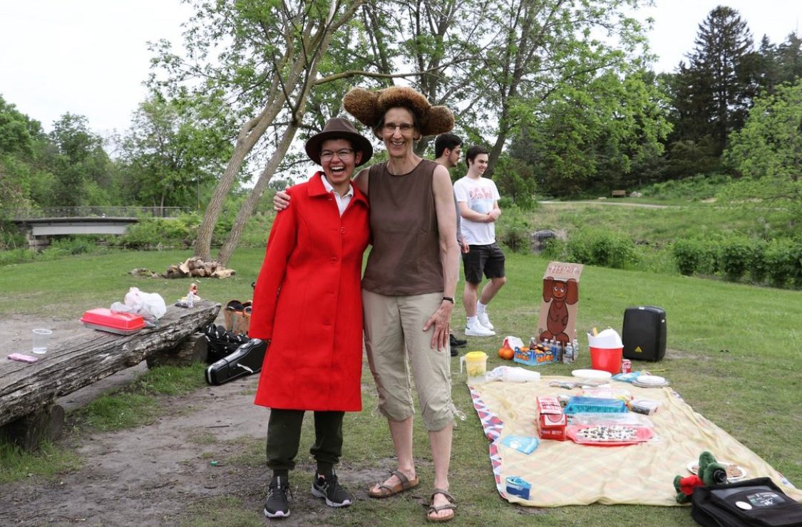 A student and professor dressed as two characters from a Russian cartoon