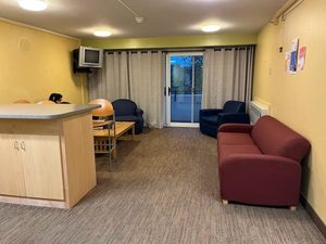 A common area in Watson, featuring a few chairs and a couch