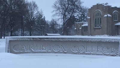 carleton college sign covered in snow