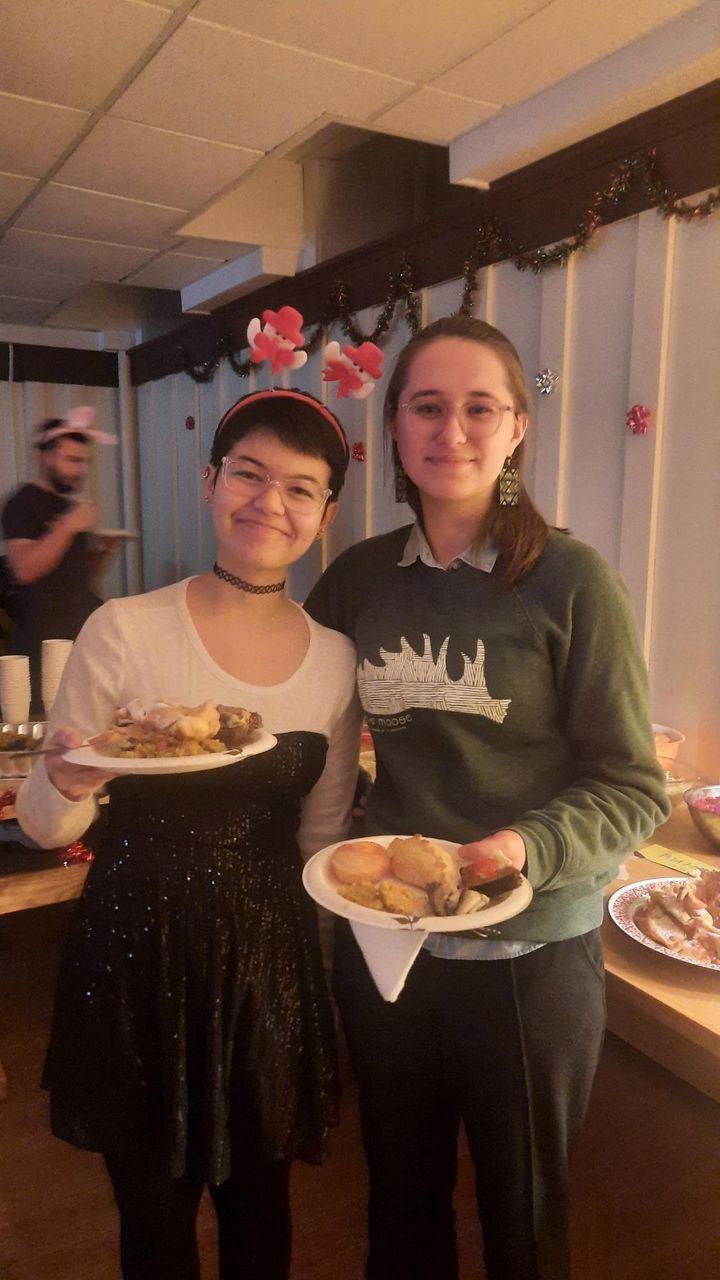 Lexi and Chloe smile with Central Asian food