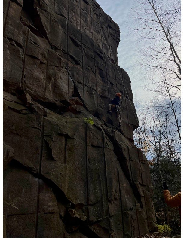 George on sandstone wall rock climbing