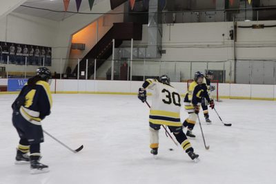 hockey player skating after puck