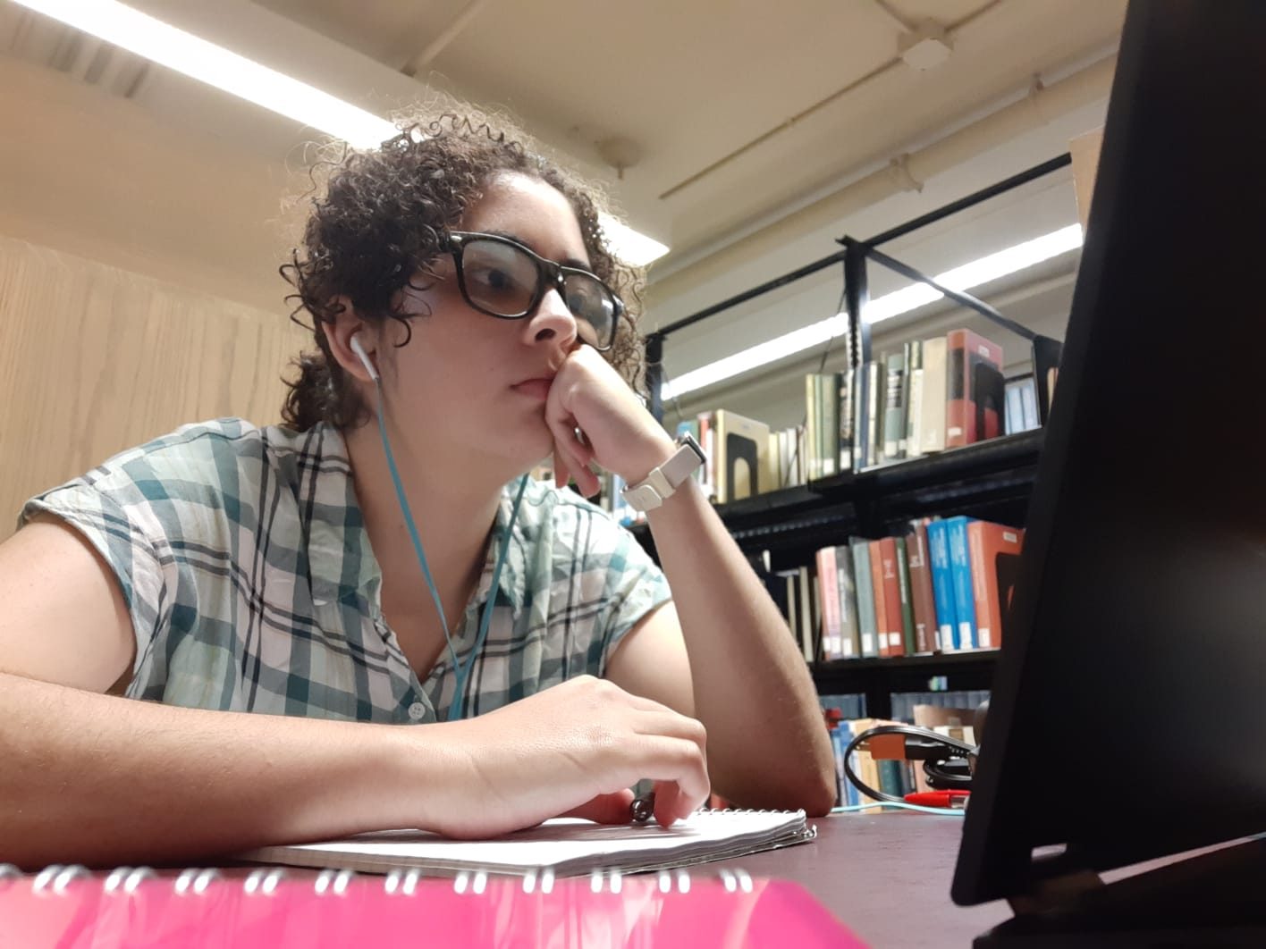 The auhtor stares at her computer while reading.
