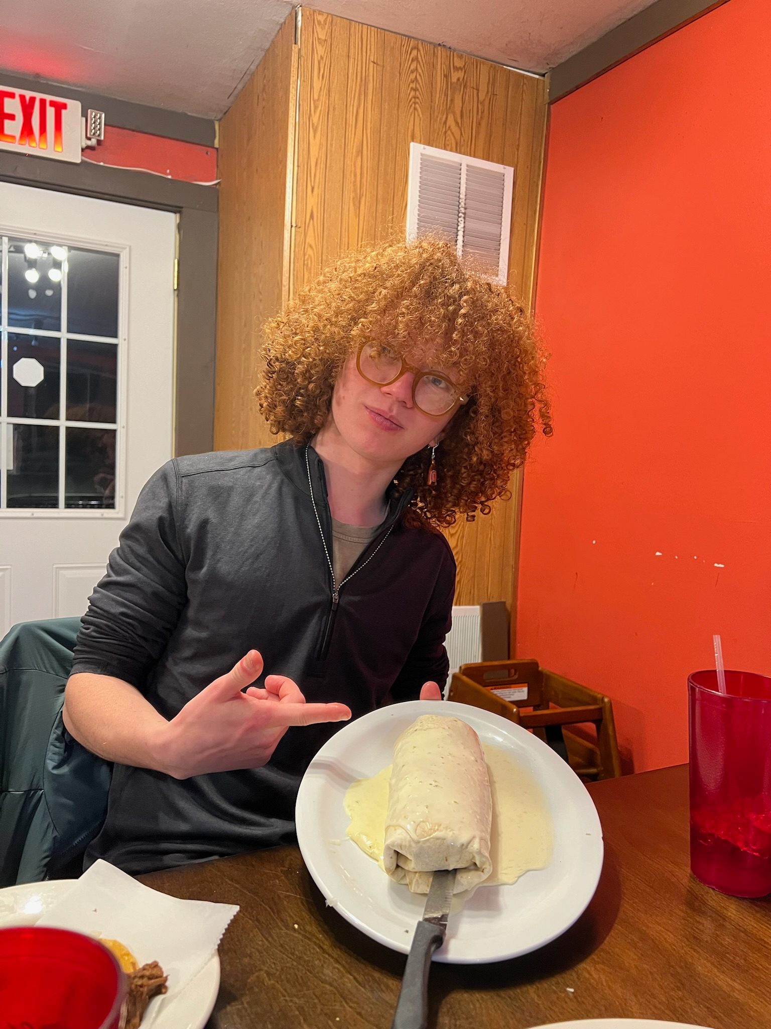George holding a huge burrito