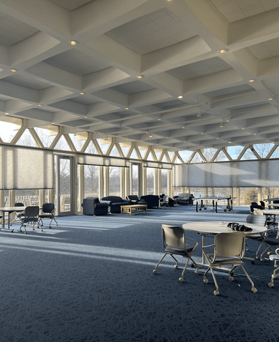 big open room with tables, chairs, ping pong, couches