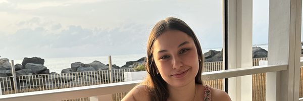 Jocelyn sitting at an outdoor restaurant table