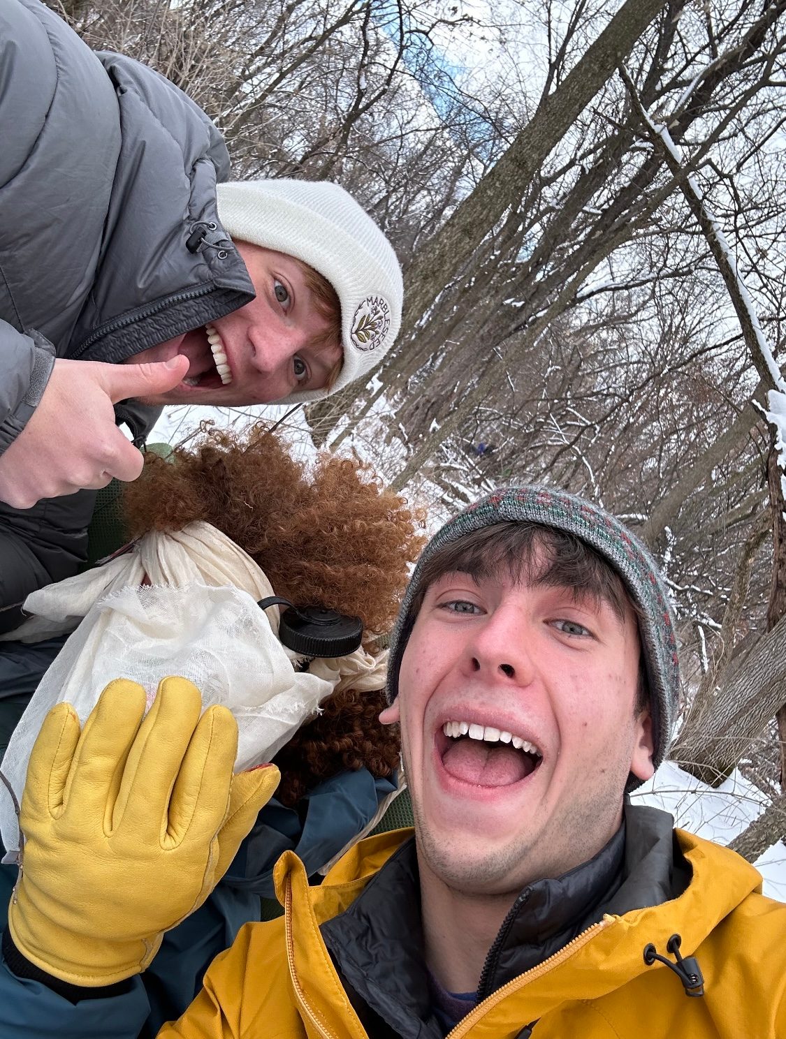 three people posing for a selfie, one with a bandage on the eye.