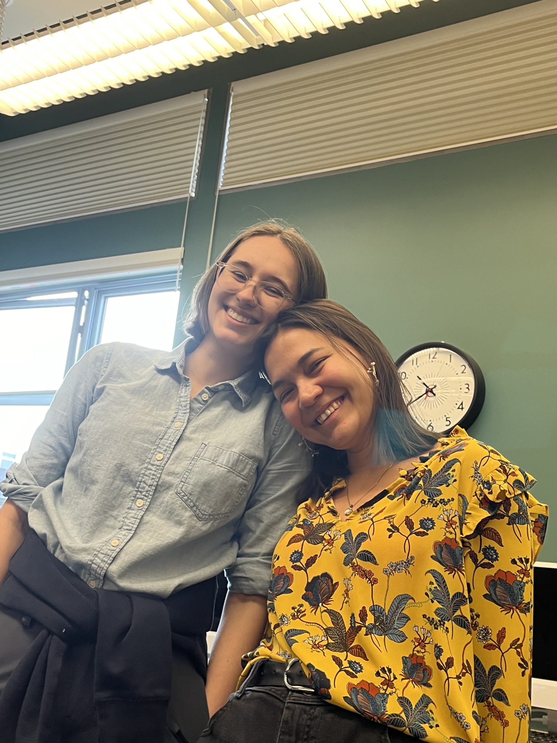 Chloe and Darina embrace in an LDC classroom