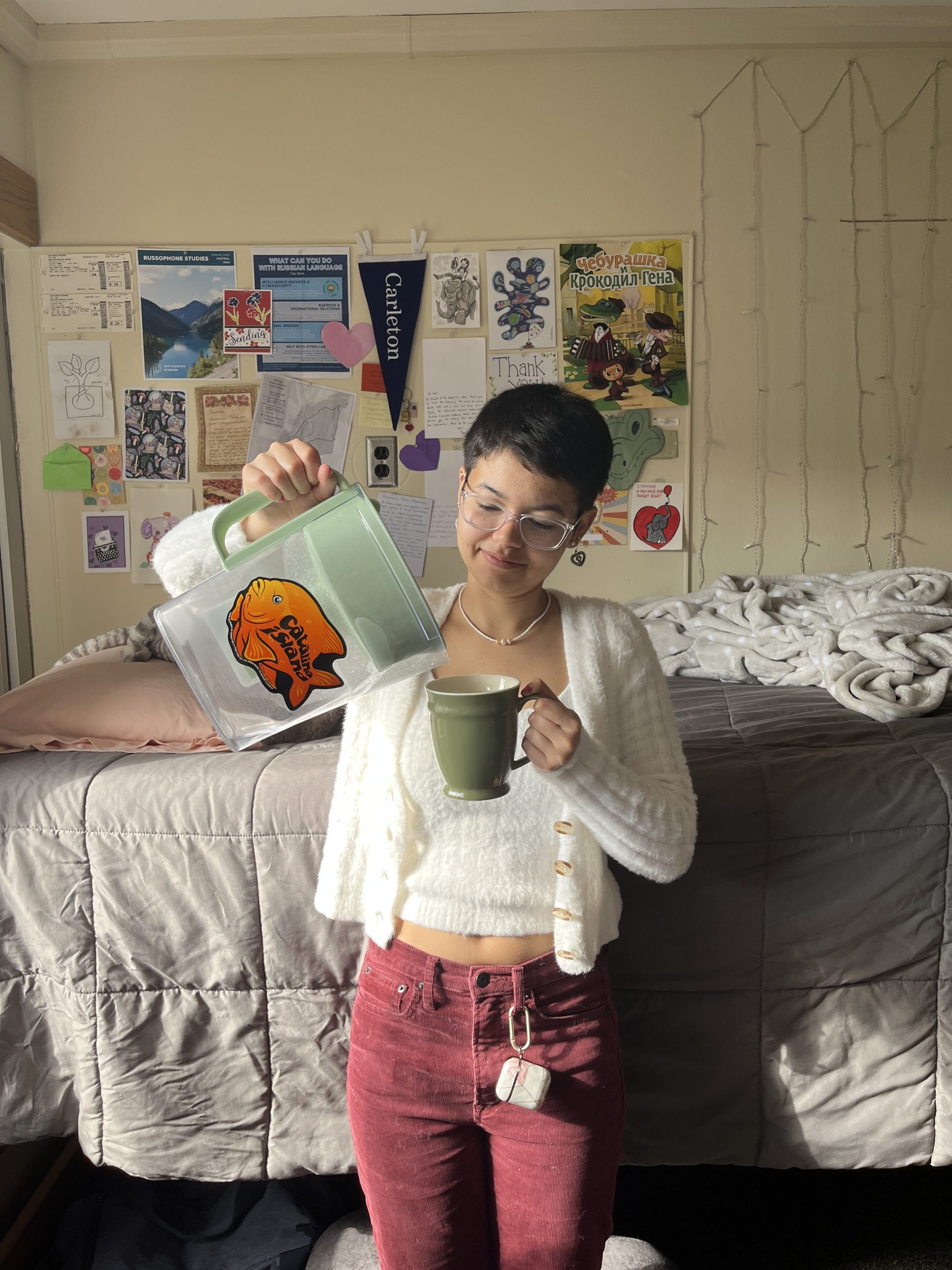 Lexi pours water into her reliable mug