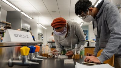 Students pipetting in an introductory-level chem