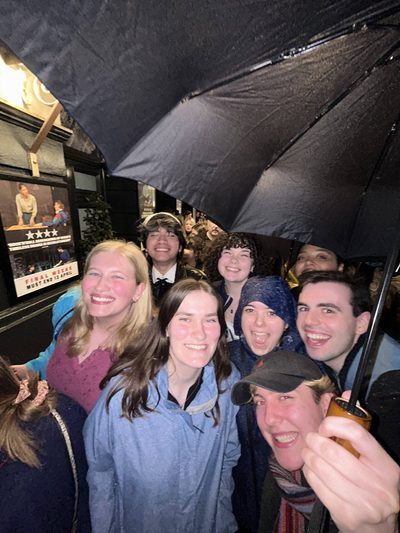 a group of students in the rain