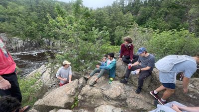 people chilling on rocks