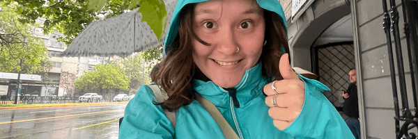 allison taking a selfie while wearing a raincoat