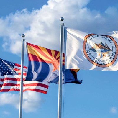 US flag, Arizona flag, local and tribal flag, flying in the wind