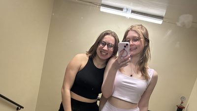 two girls in front of a mirror