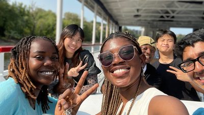 Six students holding peace signs