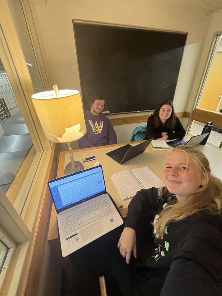 three people in study room