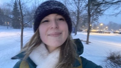 A girl smiling in the snow