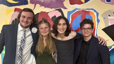 four people posing at mid winter ball
