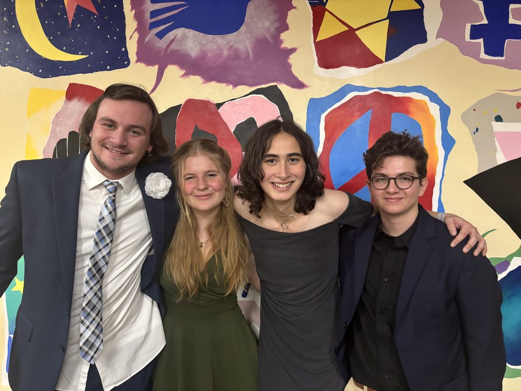 four people posing at mid winter ball