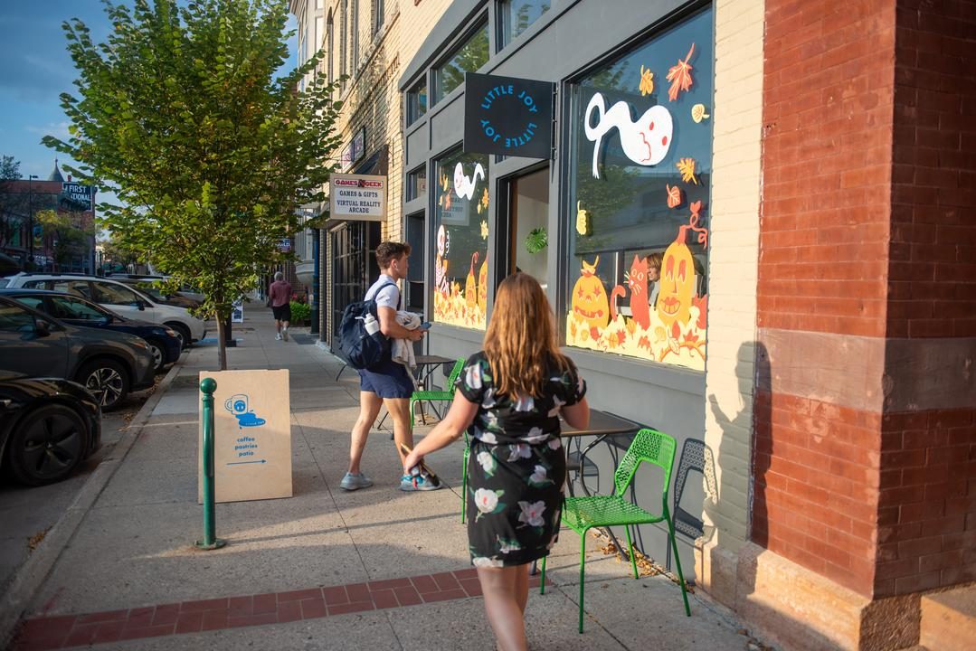 person walking down division street
