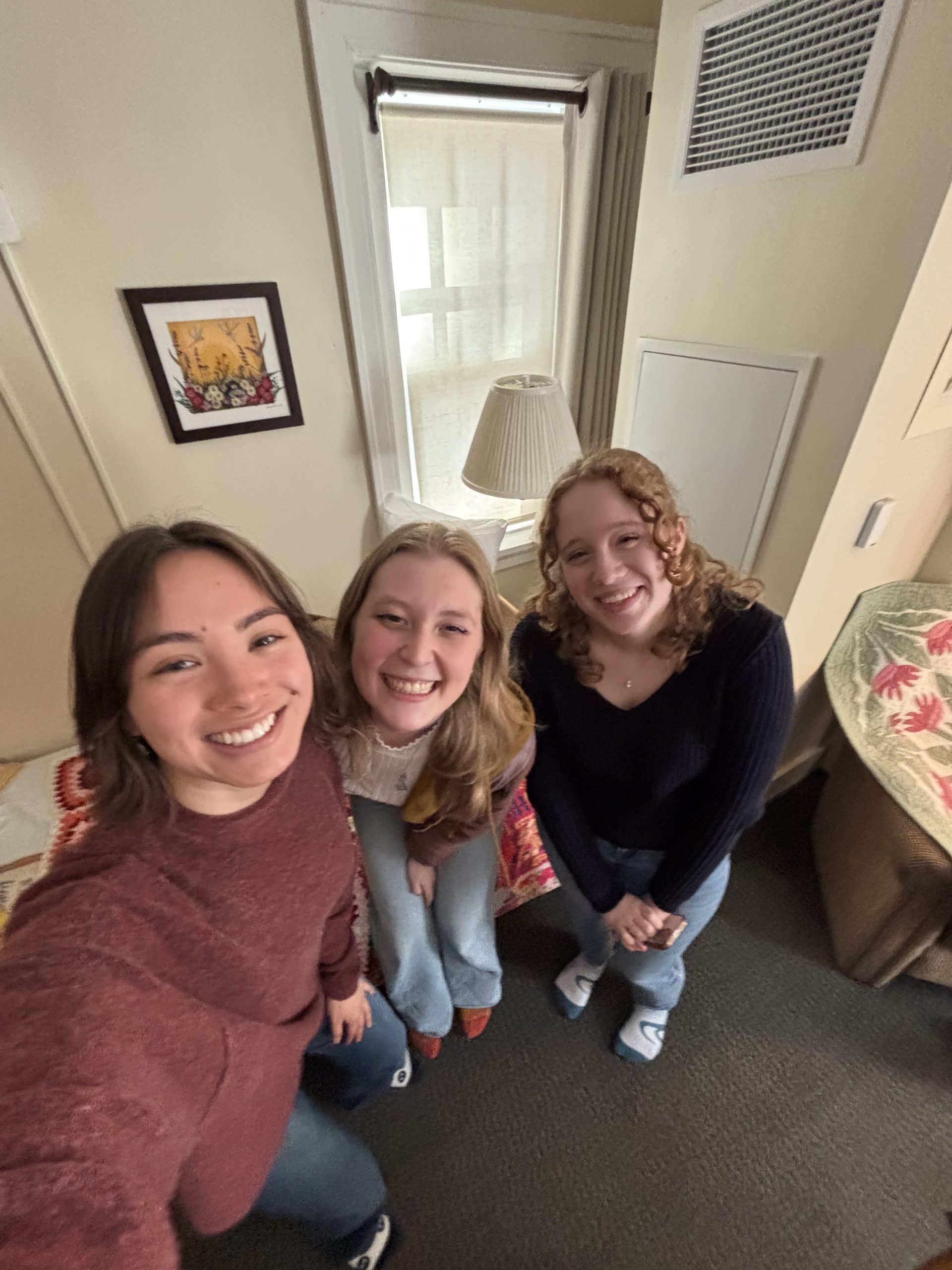 Three girls smiling at the camera