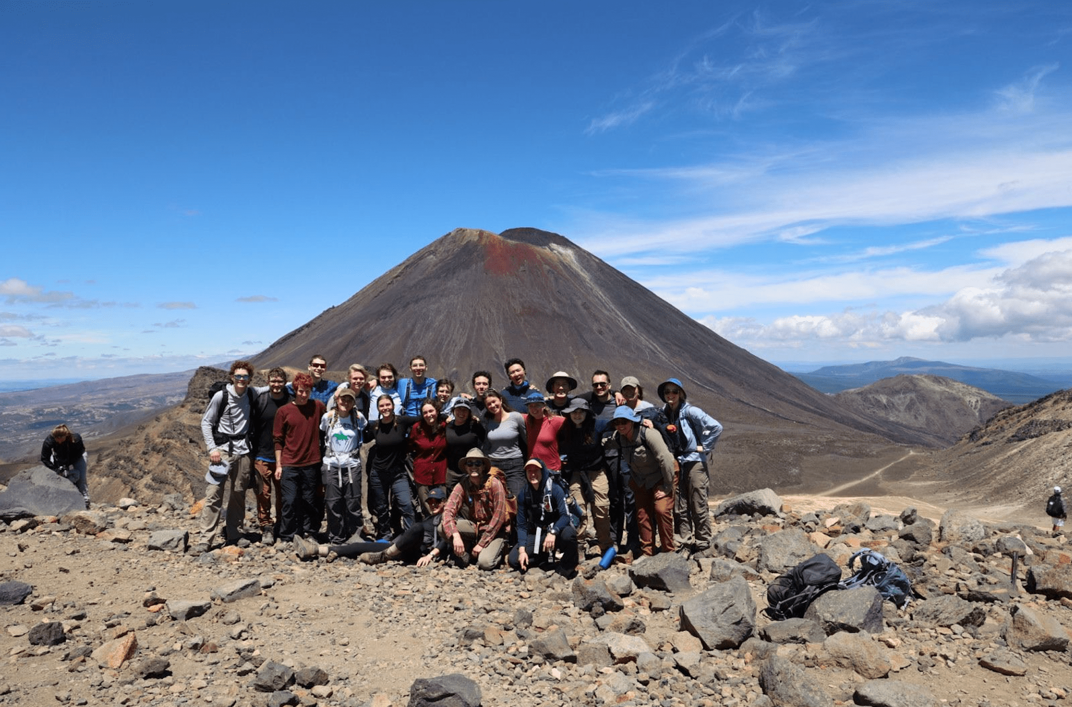 people in front of volcano