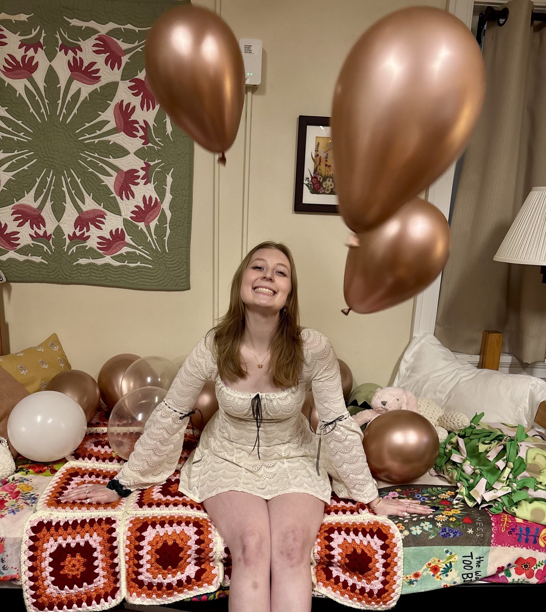 a girl smiling with balloons