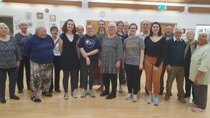 Some students with local people who contradance every week