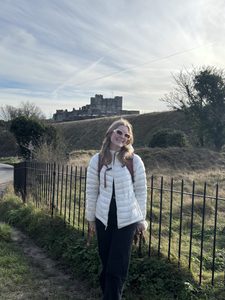 A girl in front of a castle