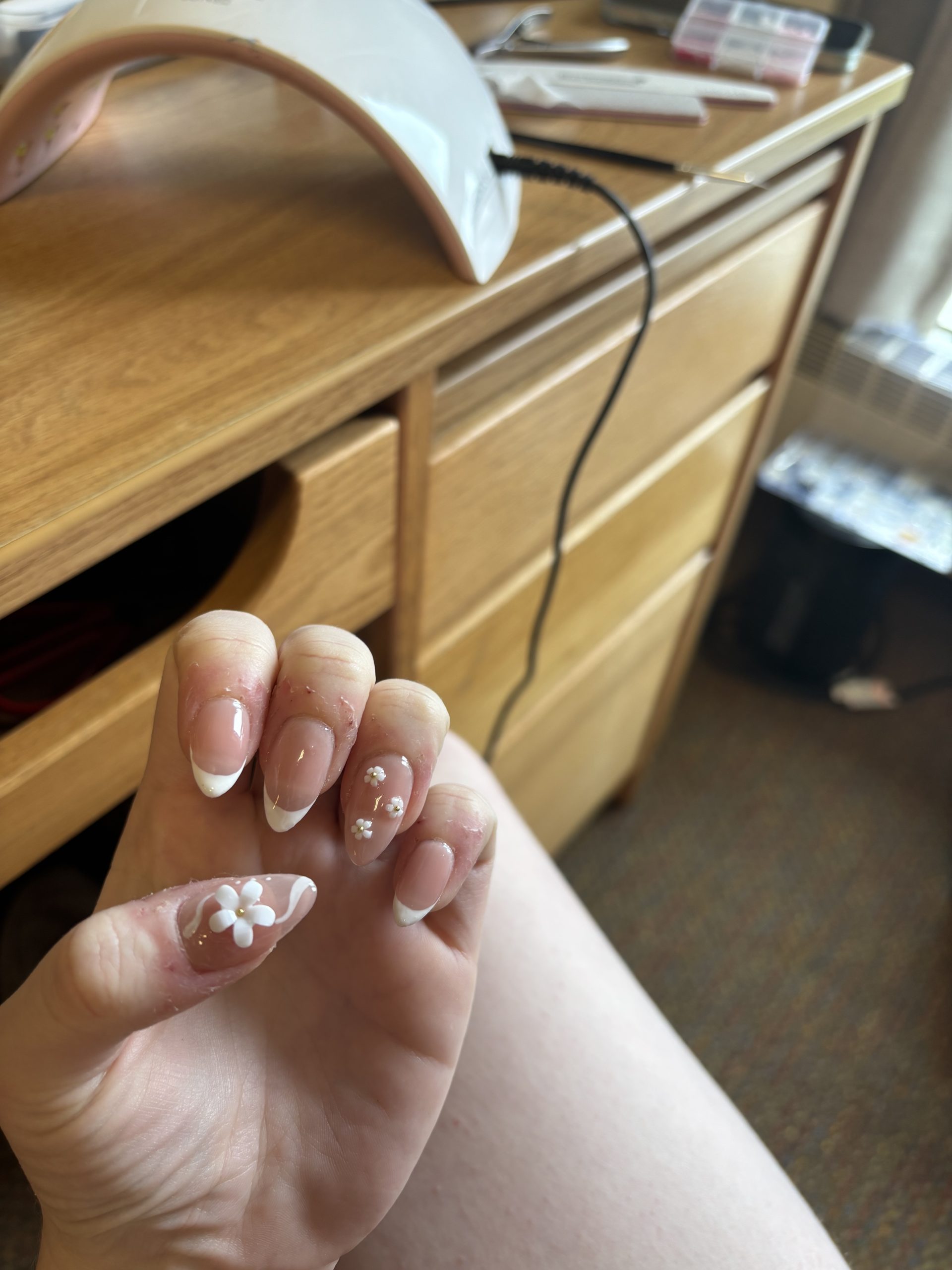 Nails with flower designs on them