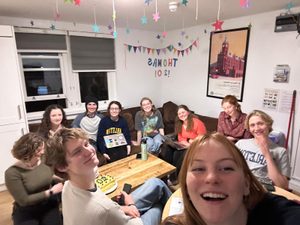 10 students smiling at the camera 