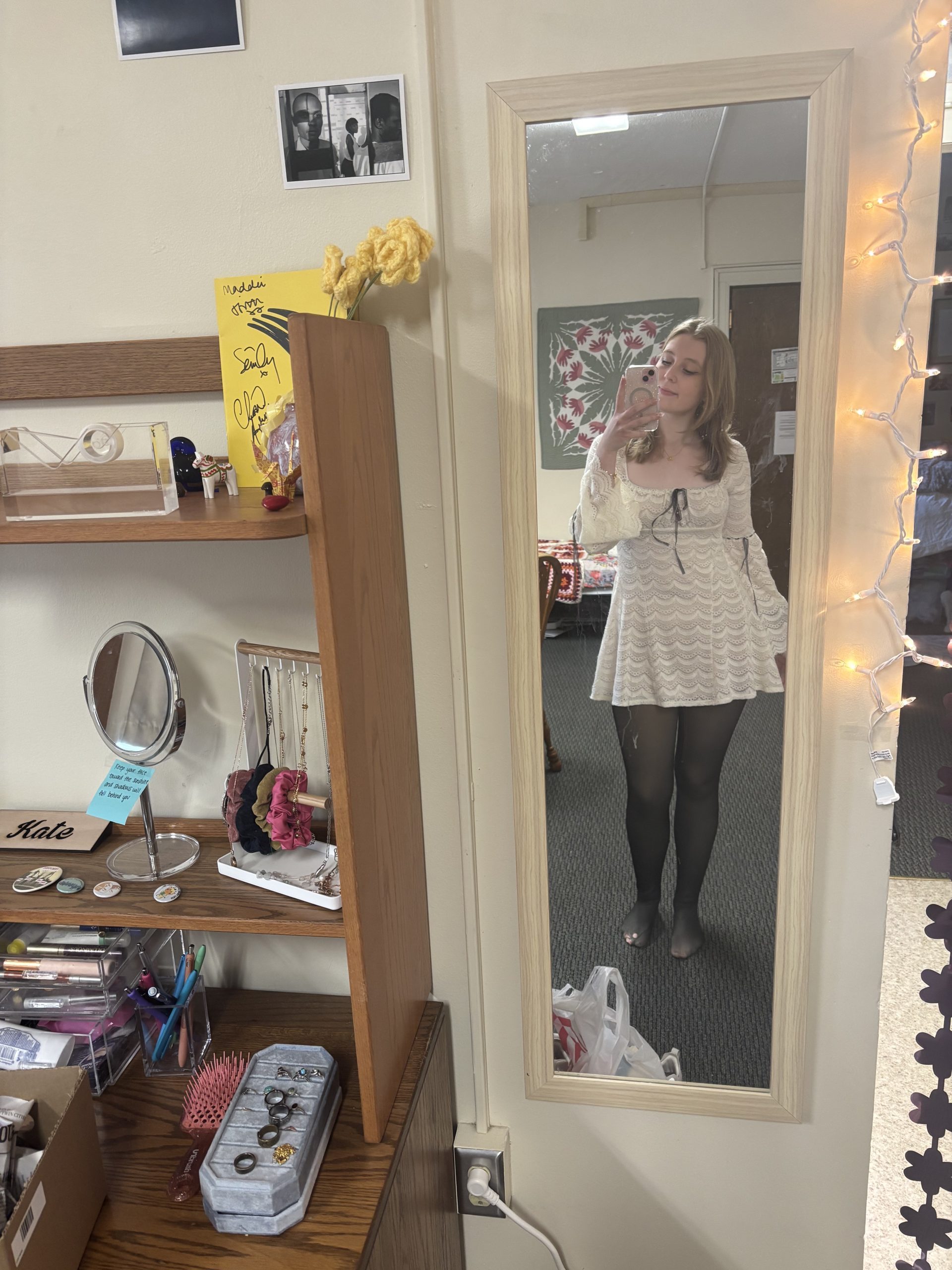 A girl with a white dress in the mirror